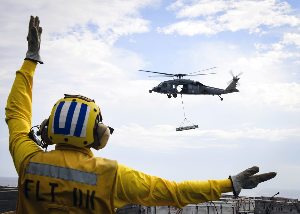 MH-60S transfers ordnance to flight deck of USS Nimitz