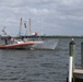 Coast Guard rescues 3, tows disabled boat for 12 hours