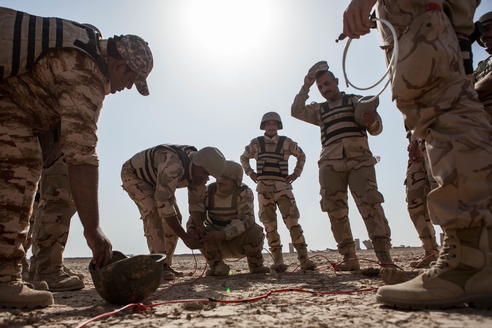 Iraqi security forces perform live fire exercise with demolitions