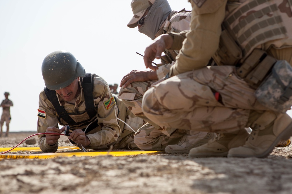 Iraqi security forces perform live fire exercise with demolitions