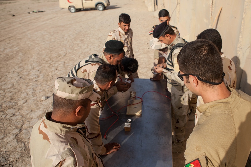 Iraqi security forces perform live fire exercise with demolitions