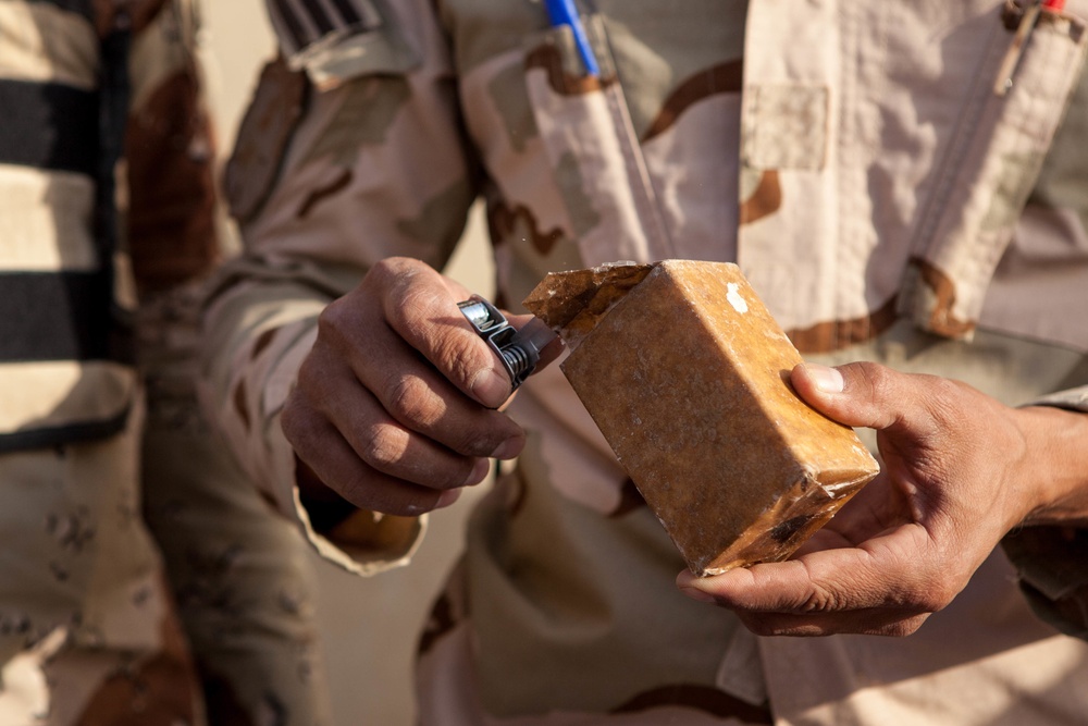 Iraqi security forces perform live fire exercise with demolitions