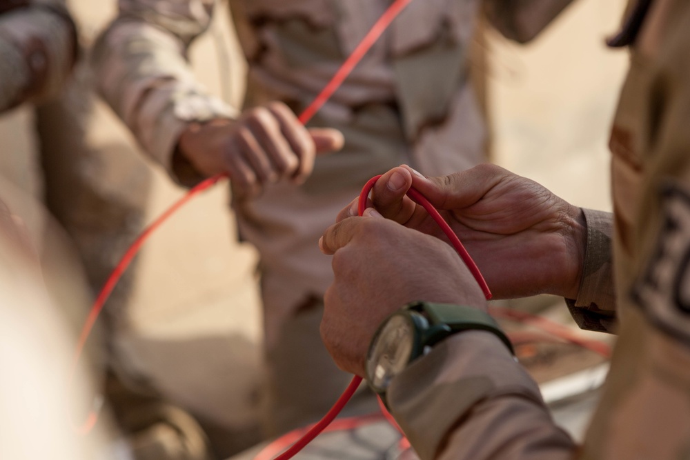 Iraqi security forces perform live fire exercise with demolitions