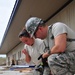 Airmen Partner with Police to Build Training Facility