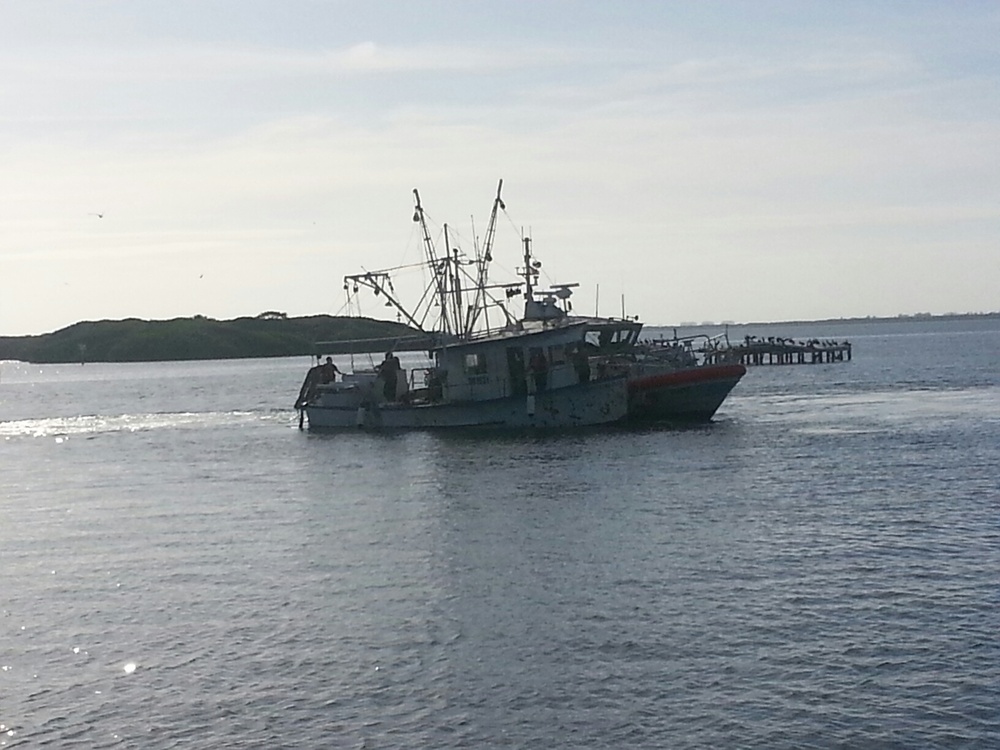 Coast Guard rescues 2 after boat takes on water