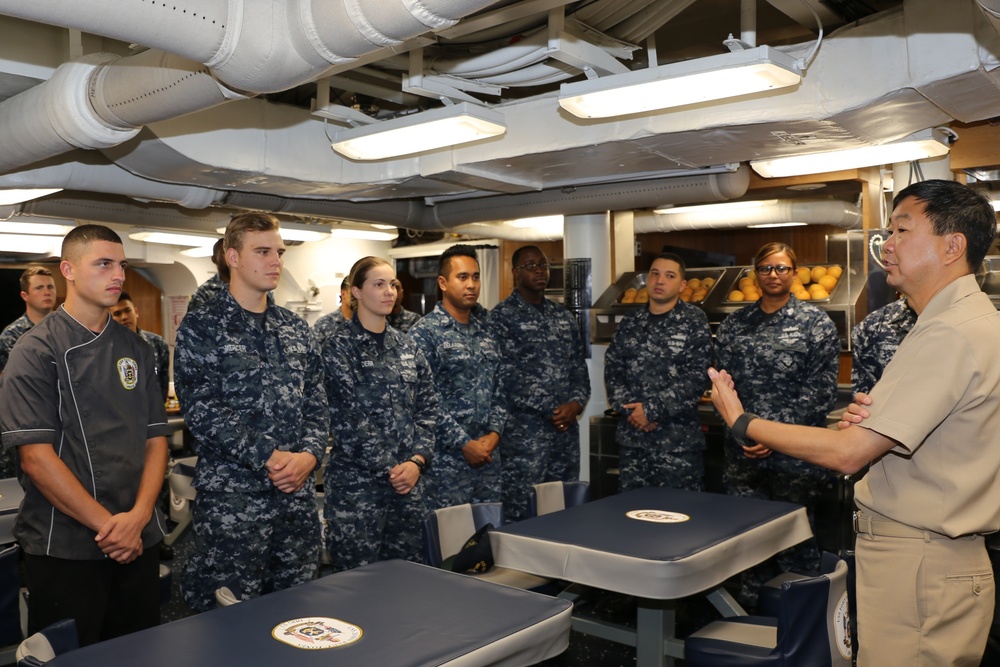 Rear Adm. Jonathan A. Yuen addresses the supply department aboard the USS John Paul Jones (DDG 53)