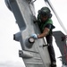Helicopter Maritime Stirke Squadon (HSM) 78 Sailor Cleans MH-60R Helo