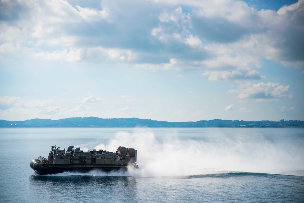 LCAC 9 transits past USS Green Bay