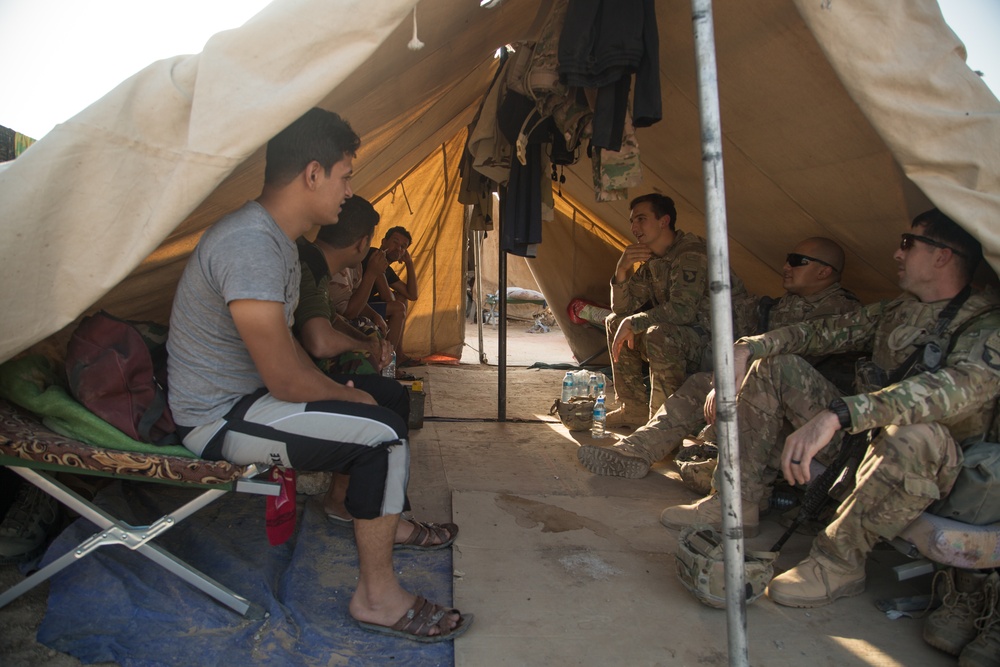 U.S. Soldiers conduct a key leader engagement at Qayyarah West Airfield