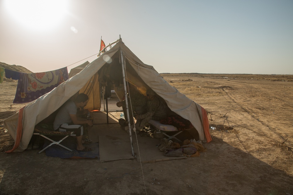 U.S. Soldiers conduct a key leader engagement at Qayyarah West Airfield