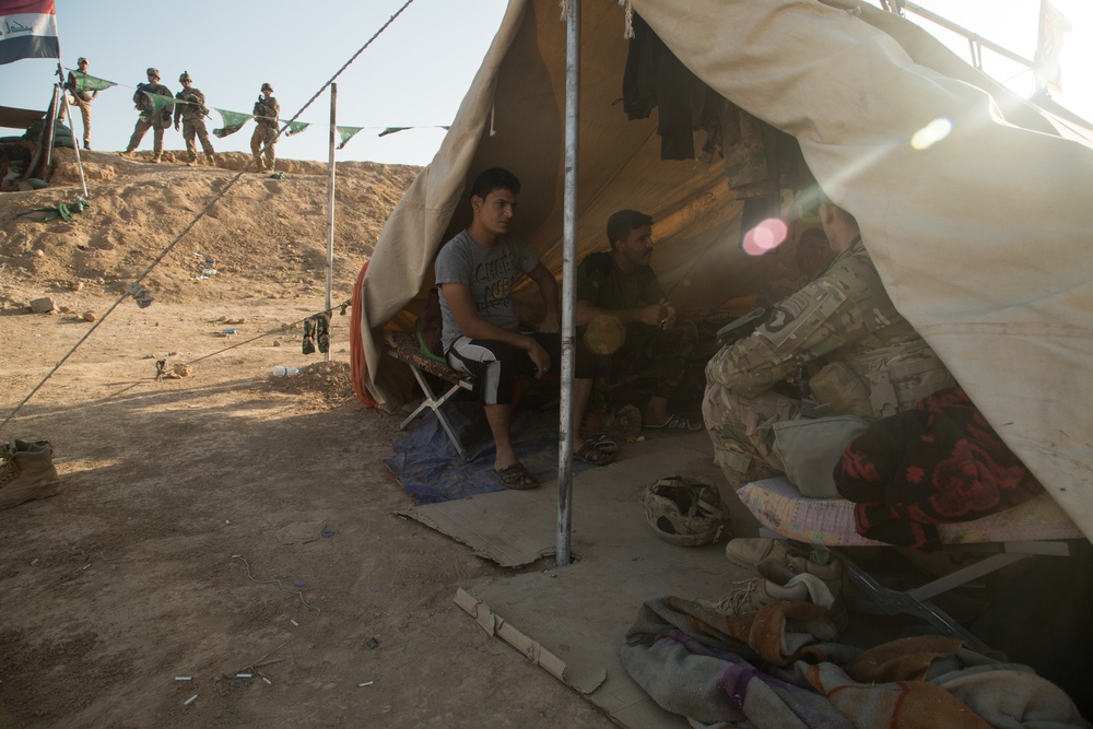 U.S. Soldiers conduct a key leader engagement at Qayyarah West Airfield