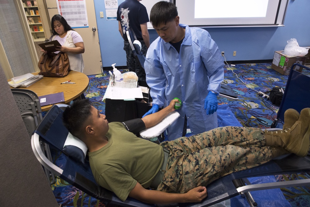 Educating, saving lives: Armed Services Blood Bank Center hosts blood drive in libraries on U.S. military installations across Okinawa