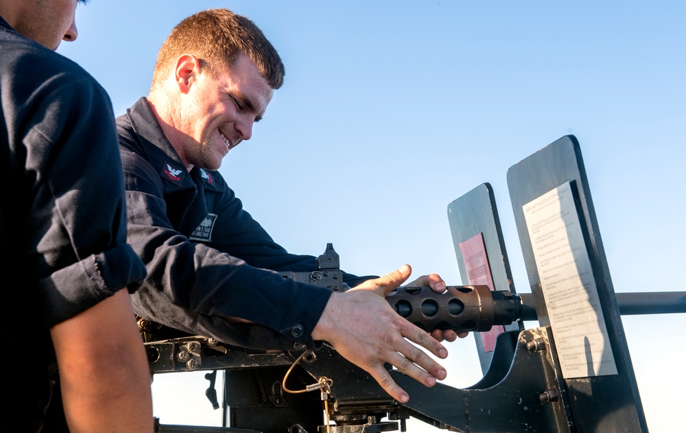 Sailor Fastens .50-caliber Gun to Mount