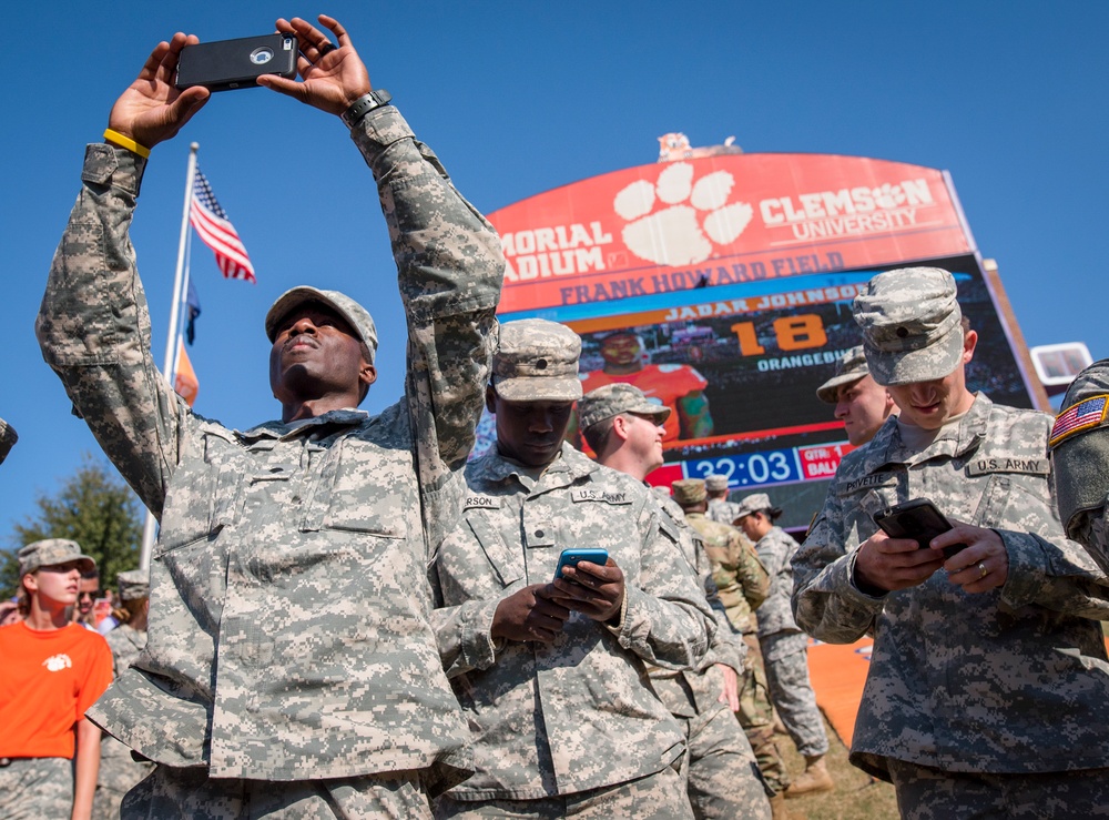 Soldiers and phones in Memorial Stadium