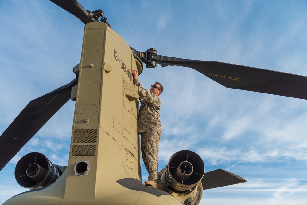 3rd Combat Aviation Brigade Soldier Prepares Chinook for Mission