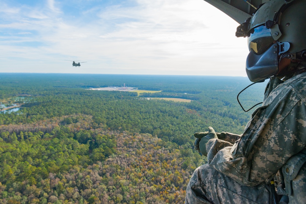 A 3rd Combat Aviation Brigade Soldier Observes Chinooks