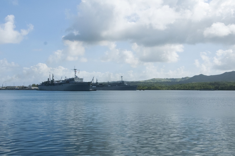 USS Frank Cable Passes USS Emory S. Land in Apra Harbor during Homecoming Nov. 8.