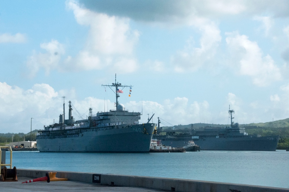 USS Frank Cable Passes USS Emory S. Land in Apra Harbor during Homecoming Nov. 8.