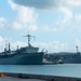 USS Frank Cable Passes USS Emory S. Land in Apra Harbor during Homecoming Nov. 8.