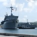 USS Frank Cable Passes USS Emory S. Land in Apra Harbor during Homecoming Nov. 8.