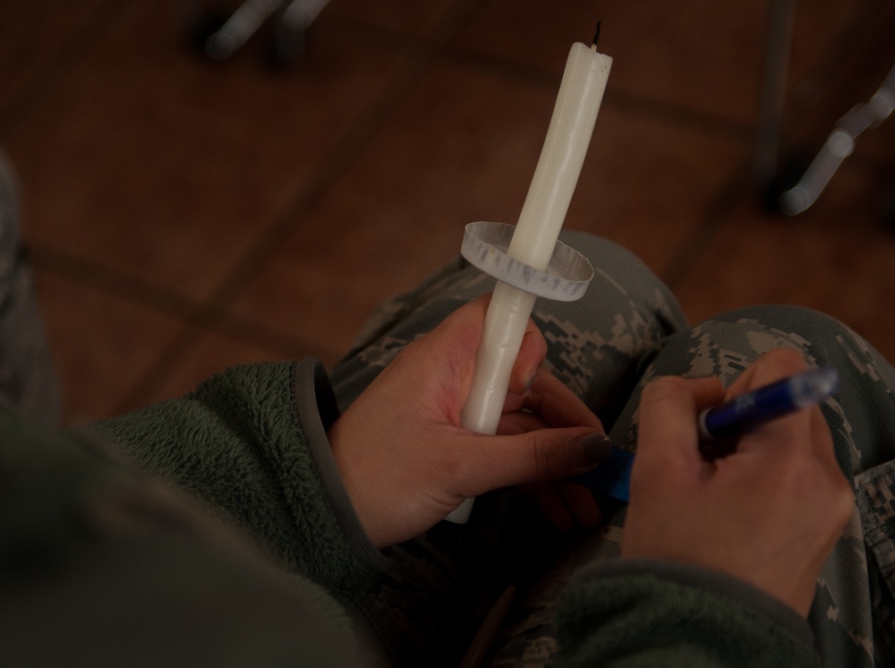 Shining light on a sensitive topic: chapel hosts candlelight vigil for interpersonal violence victims