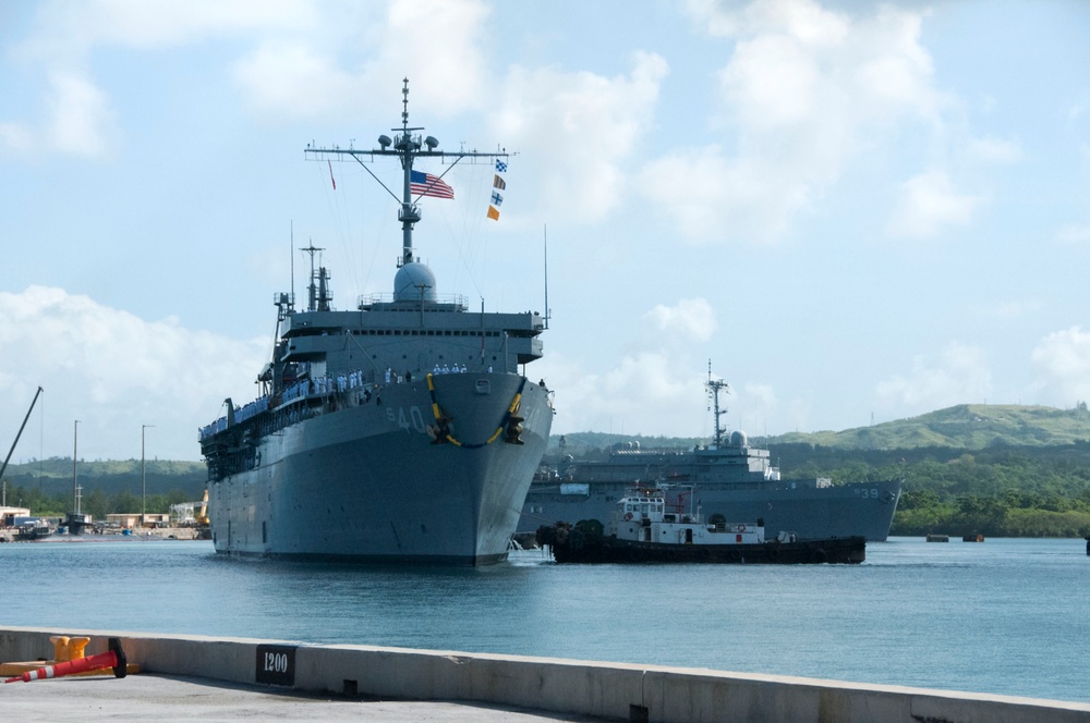 USS Frank Cable Passes USS Emory S. Land in Apra Harbor during Homecoming Nov. 8.