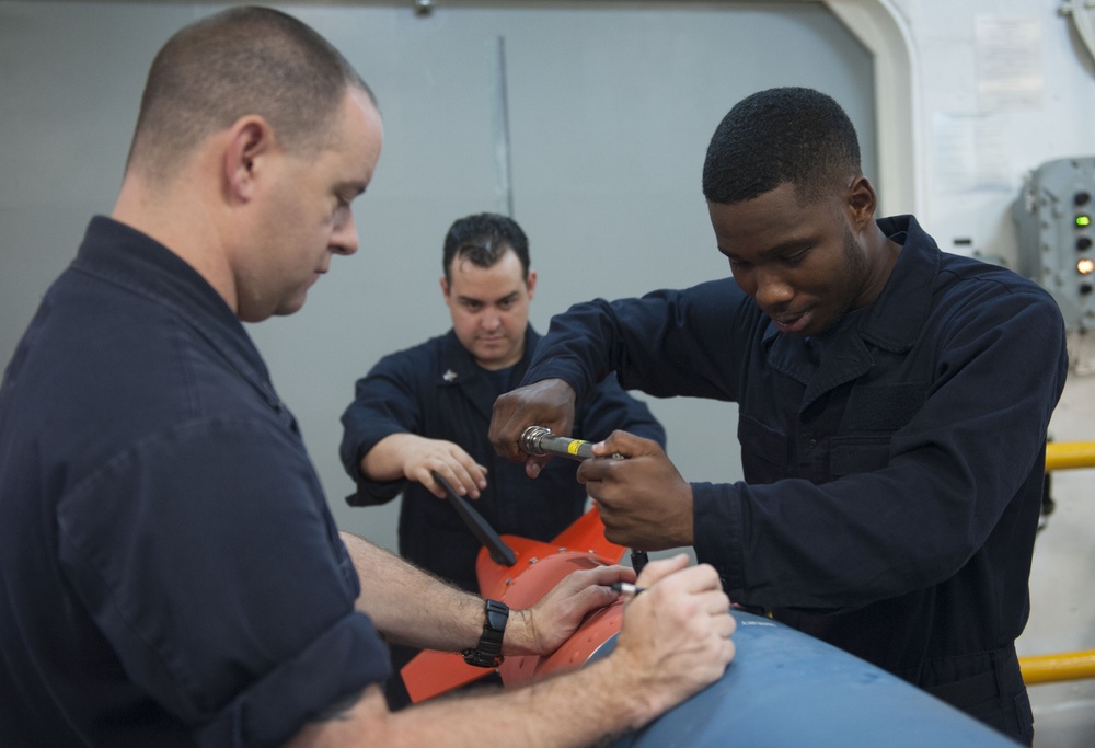 USS America’s Weapons Department preps test bombs for F-35B