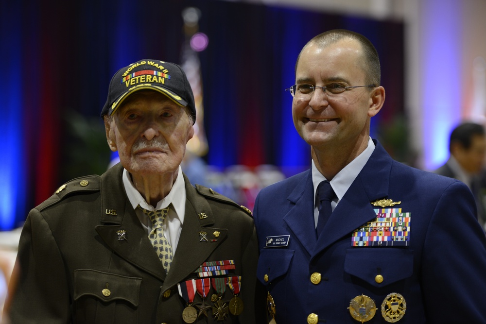 Admiral Michel stands with honored veteran