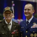Admiral Michel stands with honored veteran