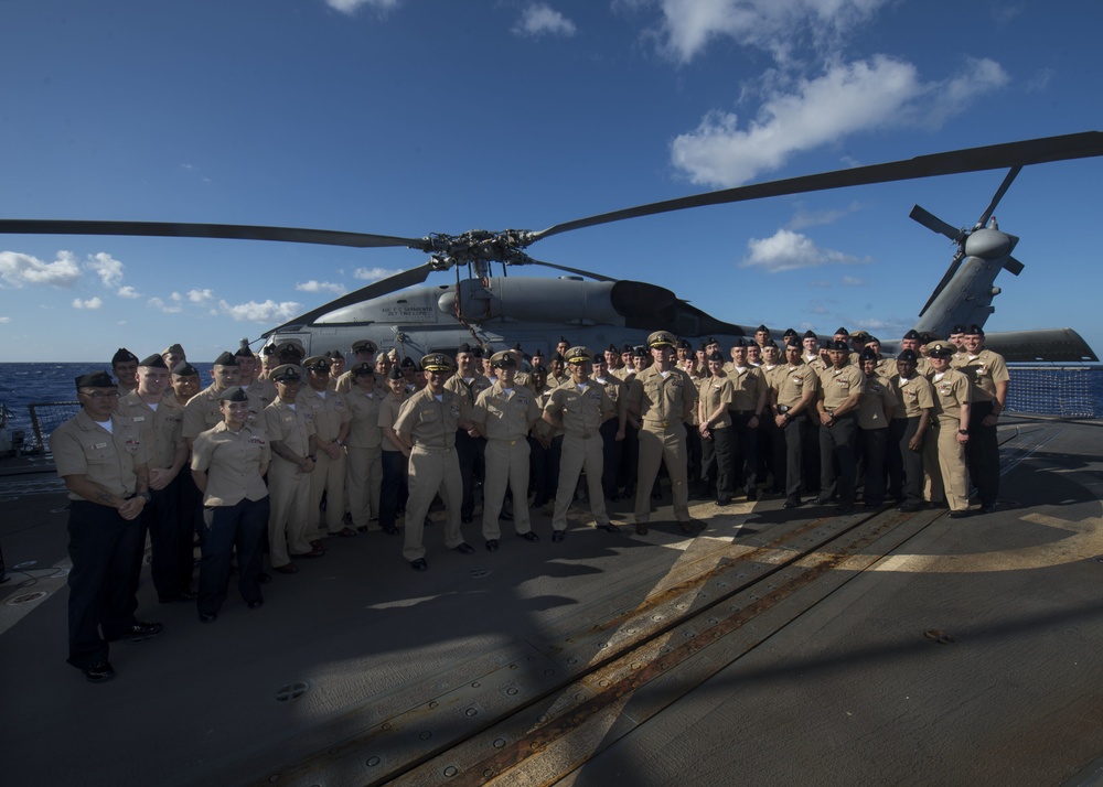 Sailors aboard USS Spruance (DDG 111) hold pinning ceremony for  the first Enlisted Aviation Warfare Specialist program aboard a destroyer.