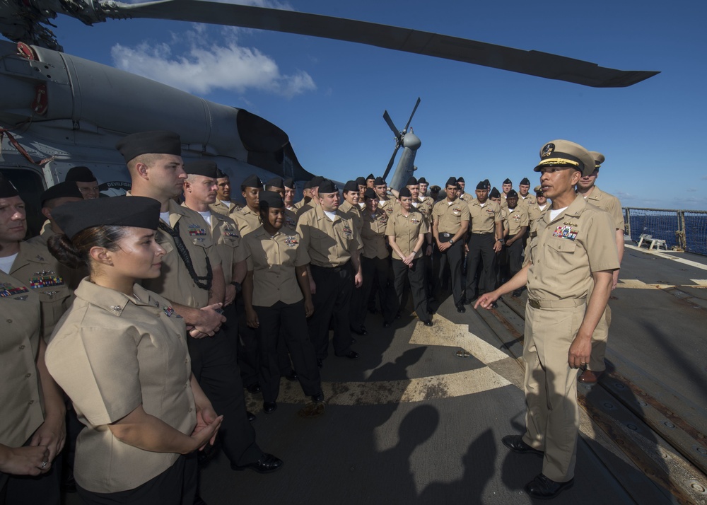 Sailors aboard USS Spruance (DDG 111) hold pinning ceremony for  the first Enlisted Aviation Warfare Specialist program aboard a destroyer.