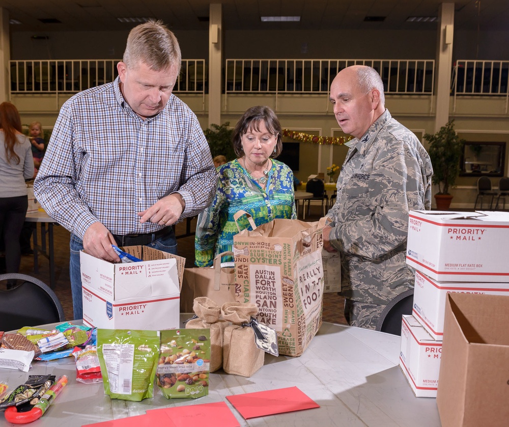 Families prepare holiday packages for deployed Airmen