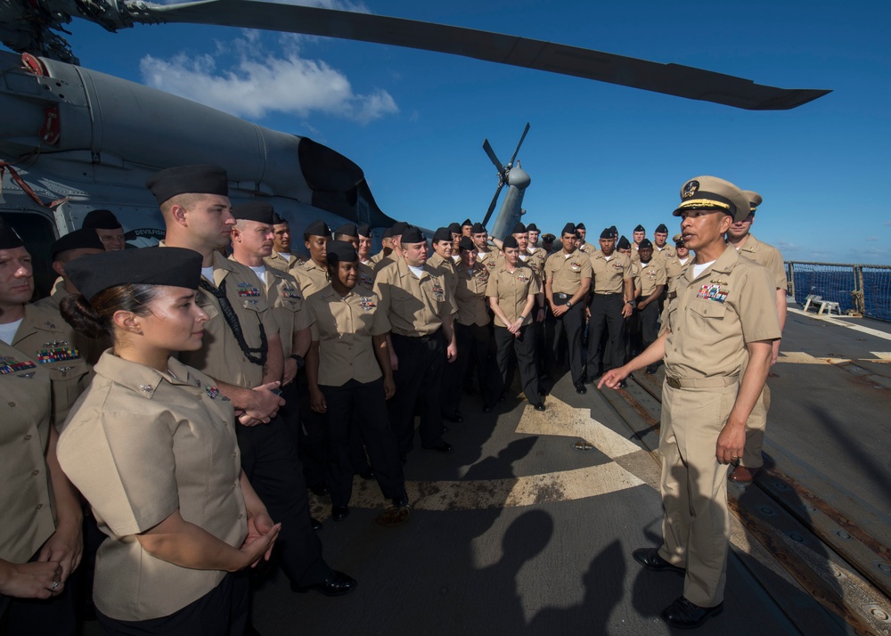 Sailors aboard USS Spruance (DDG 111) hold pinning ceremony for  the first Enlisted Aviation Warfare Specialist program aboard a destroyer.