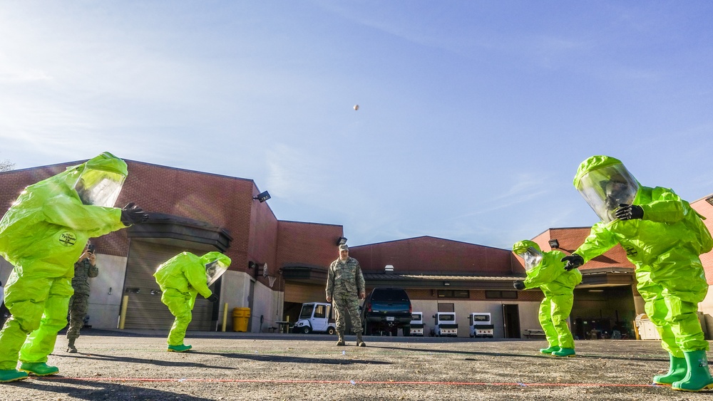 Airmen test dexterity in HAZMAT suits
