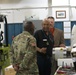 Letterkenny Munitions Center employee, Mr. Herbert Bailey, briefs Brig. Gen. Richard Dix, Commanding General of Joint Munitions Command during his visit while Mr. Brentley Gamble looks on.