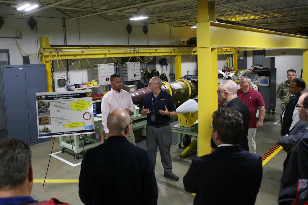 LEMC employees brief local community leaders during their tour of LEMC's MLRS Family of Munitions facilities.