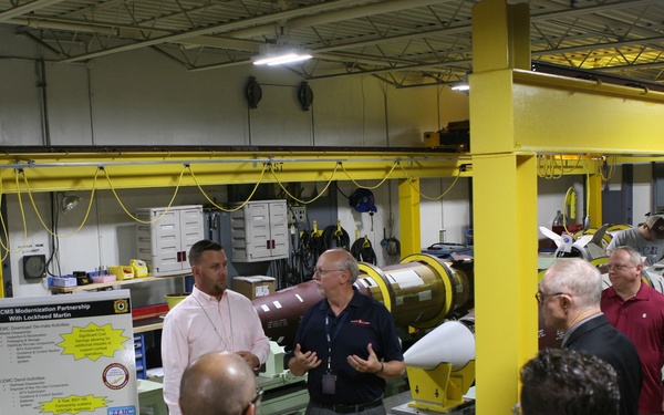 LEMC employees brief local community leaders during their tour of LEMC's MLRS Family of Munitions facilities.