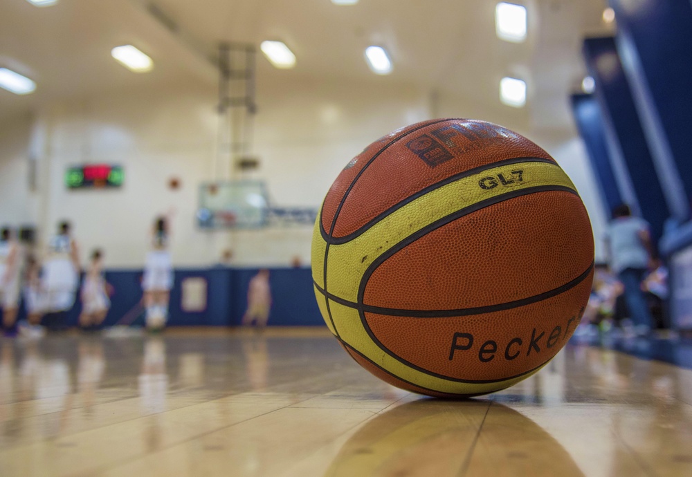 Basketball lying on court