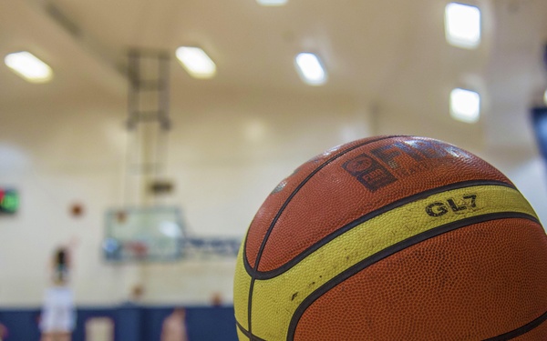 Basketball lying on court