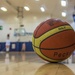 Basketball lying on court