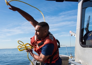 Coast Guard members conduct disabled vessel assist training