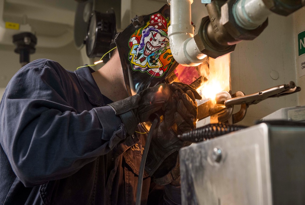 USS Wayne E. Meyer Sailors Welding