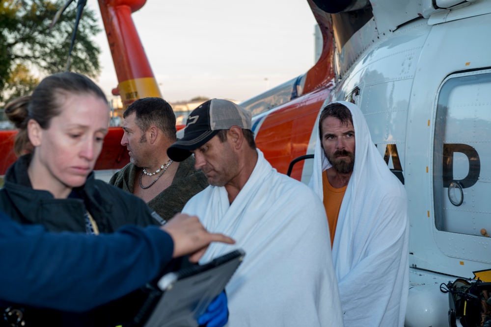 Michael De Nyse.   Coast Guard Air Station Clearwater rescues 3