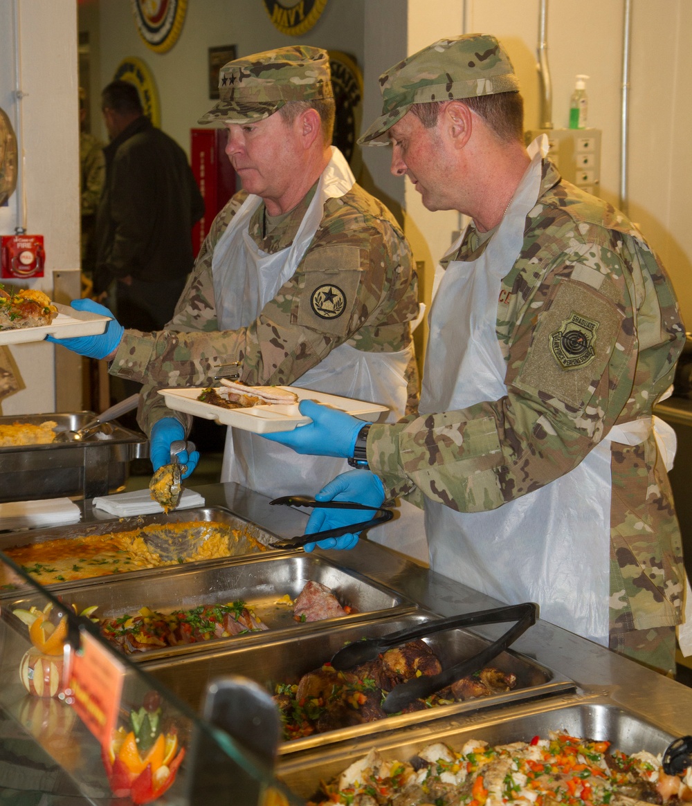 Gen. Joseph Lengyel and Air Force, Maj. Gen. John Nichols serve Thanksgiving lunch