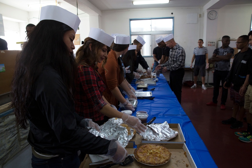 Camp Kinser service members serve Thanksgiving meal at Okinawa homeless shelter