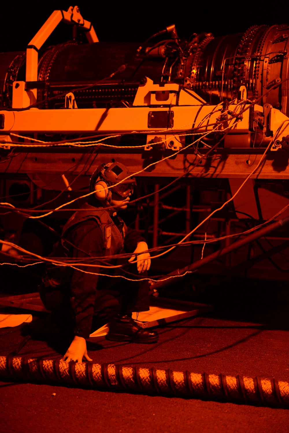 Sailors work on the fantail of USS Nimitz