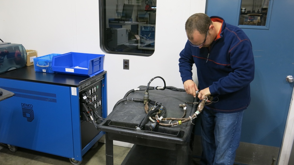 Letterkenny Munitions Center Electronic Measurement Equipment Mechanic, Chad Reams, tests an ATACMS interface cable using DIT-MCO test equipment.