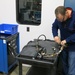 Letterkenny Munitions Center Electronic Measurement Equipment Mechanic, Chad Reams, tests an ATACMS interface cable using DIT-MCO test equipment.