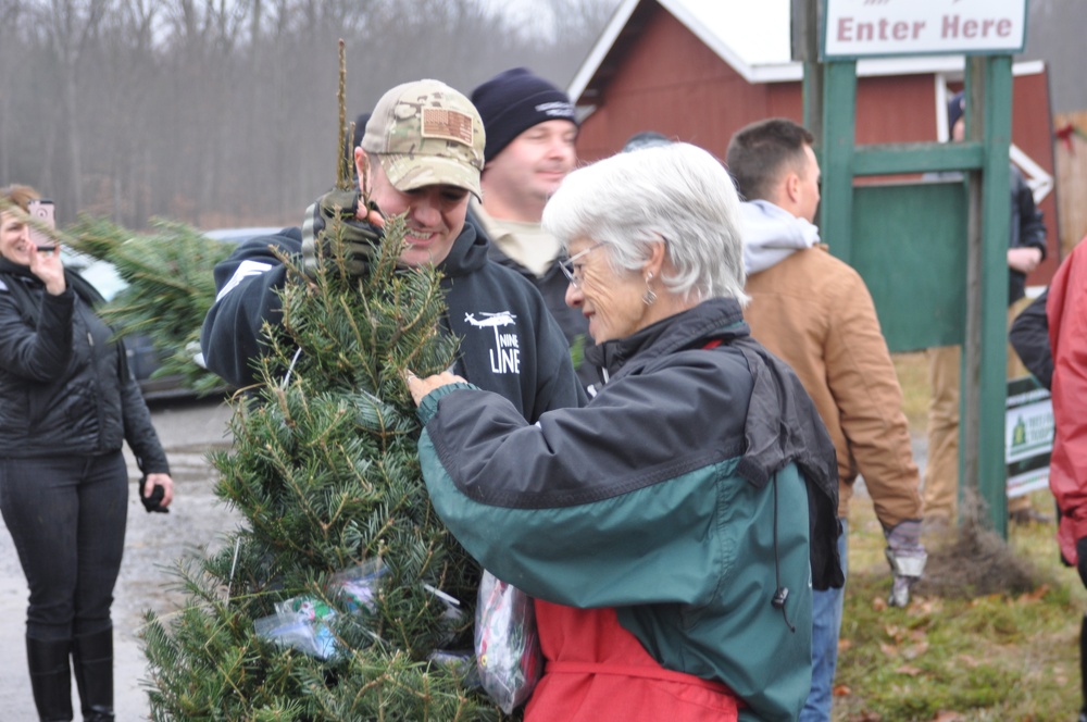Air Guard Volunteers Help Load Trees for Troops