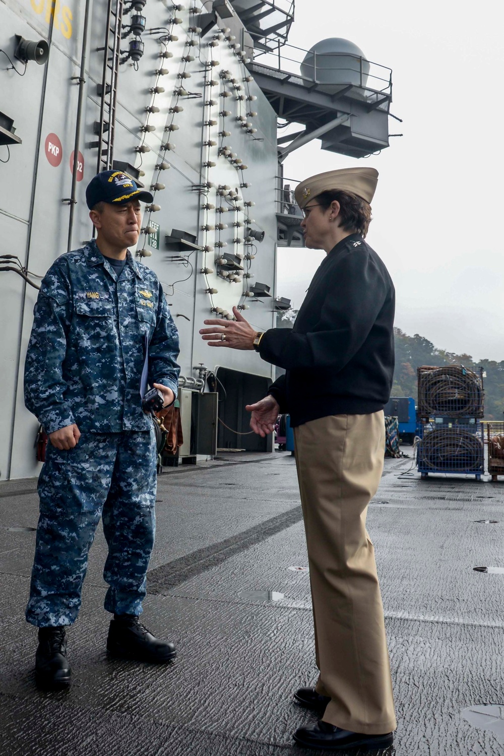 Navy Chief of Chaplains, Rear Adm. Margaret G. Kibben, speaks with Cmdr. David S. Yang On the Flight Deck of the USS Ronald Reagan